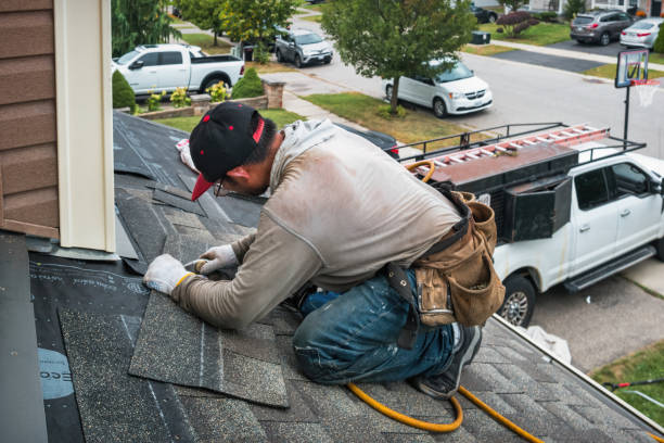 Professional Roof Replacement technician working in Foster, KY